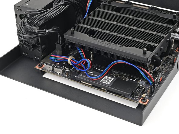 Optionally, you can shorten the power button cable and tuck it under the heatsink to keep it out of the way.