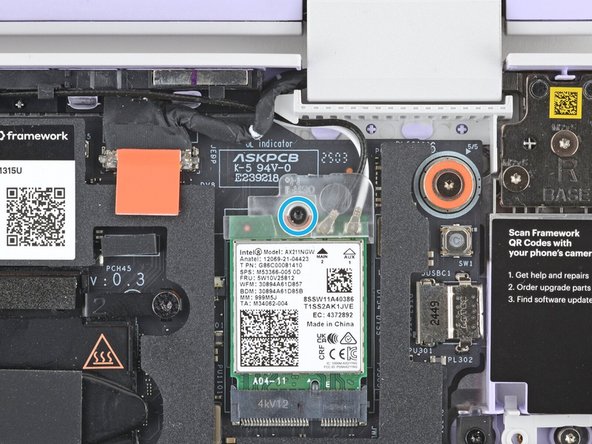 Use your Framework Screwdriver to tighten the captive T5 Torx screw to secure the Wi-Fi card.