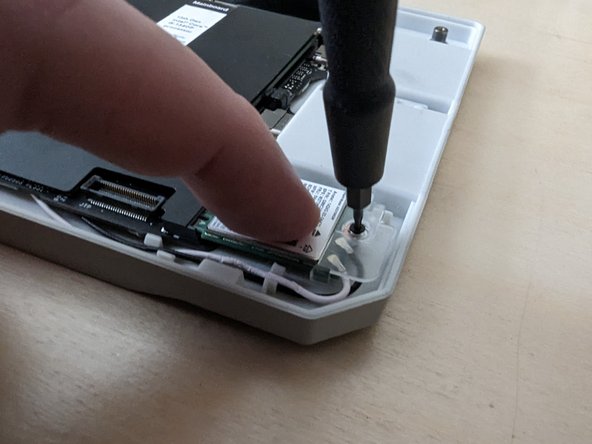 If you are using the metal WiFi bracket that came with the case, you can align it using the post highlighted in orange. Using one of the three smaller fasteners that are included with the case.