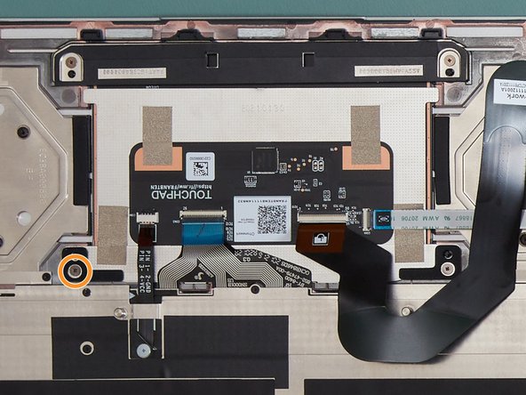 Loosen the fastener circled in orange by 1 full turn, using the PH0 bit on your Framework Screwdriver.  The bit is two sided, so flip it around if the T5 end is currently out.