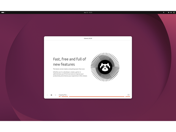 Installation runs:  The installer copies files and displays a slideshow while it works. When finished, you will be prompted to remove the USB and reboot.