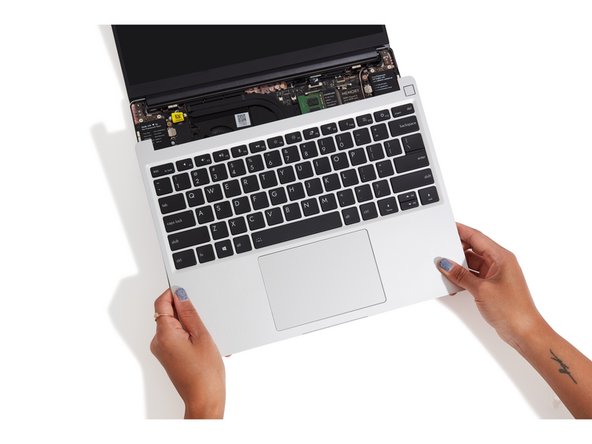 Flip the Input Cover over the Bottom Cover so that the keyboard is facing up and attach it to the Bottom Cover by aligning the top and bottom edges of both covers.