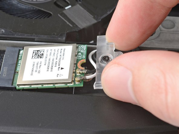 Slide the clear plastic cover on the module and align its screw with the screw hole cutout.