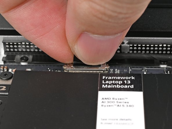 Press the Webcam Cable connector straight down into its socket to connect it.