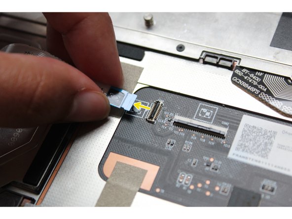 Use caution when lifting it up the Fingerprint Cable as there is some adhesive holding it to the bracket.