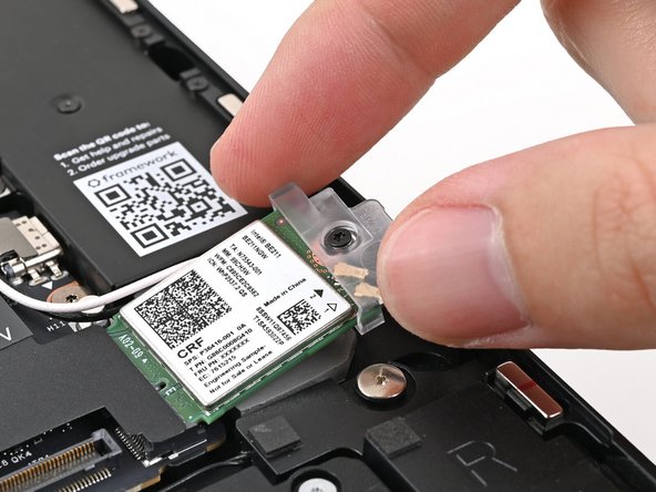 Slide the clear plastic cover onto the module and align its screw with the screw hole cutout.