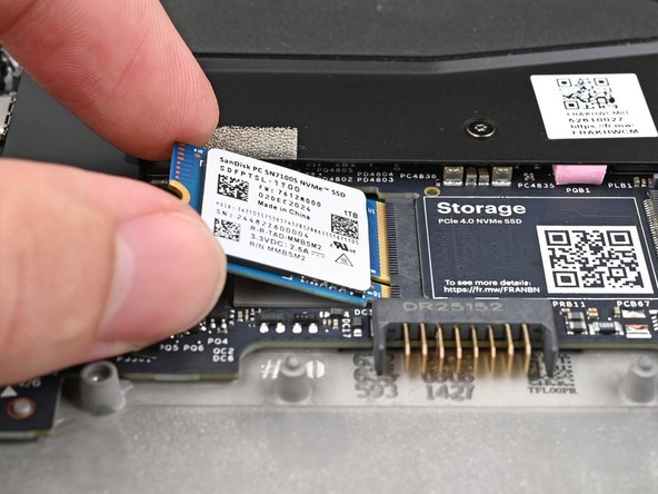 Align the SSD's gold contacts with its socket.
