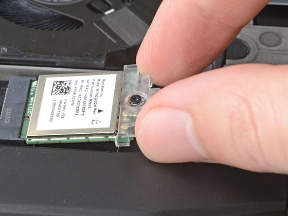 Slide the clear plastic cover on the module and align its screw with the screw hole cutout.