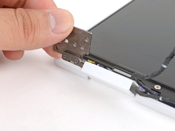 Use your fingers to twist both hinge plates so they're flipped over the display.