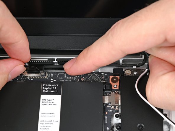 Refer to this photo for how the cable should look when properly routed.