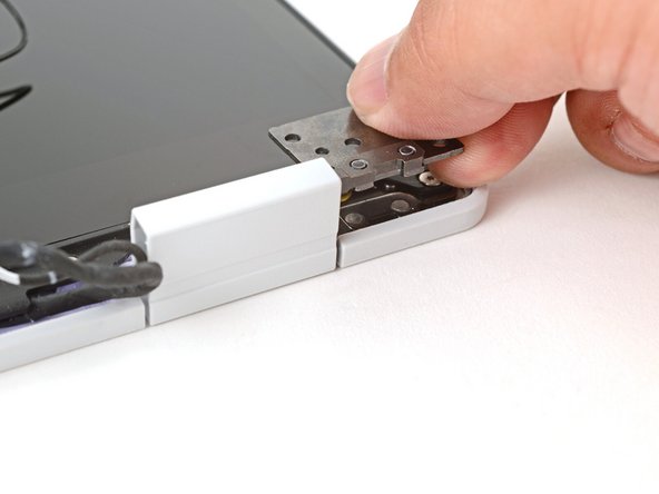 Use your fingers to twist both hinge plates so they're flipped over the display.