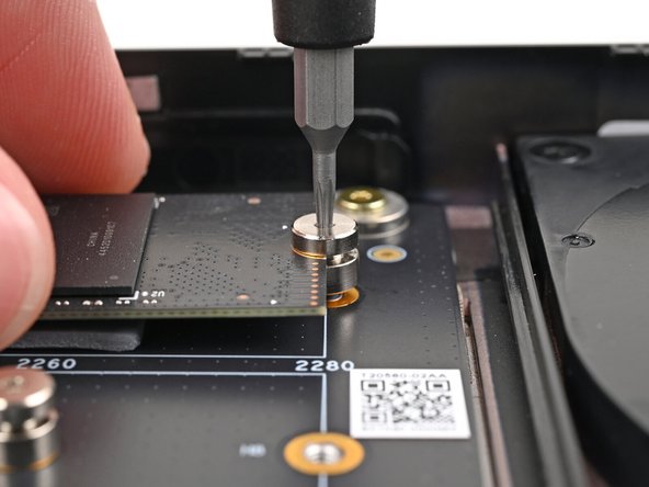 The head of the screw should completely cover the notch and its threads should slot into the adapter's screw hole.