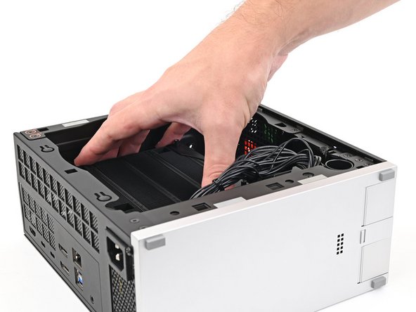 Lift the heatsink and tilt it up towards the front of the Desktop to navigate it out of the chassis.