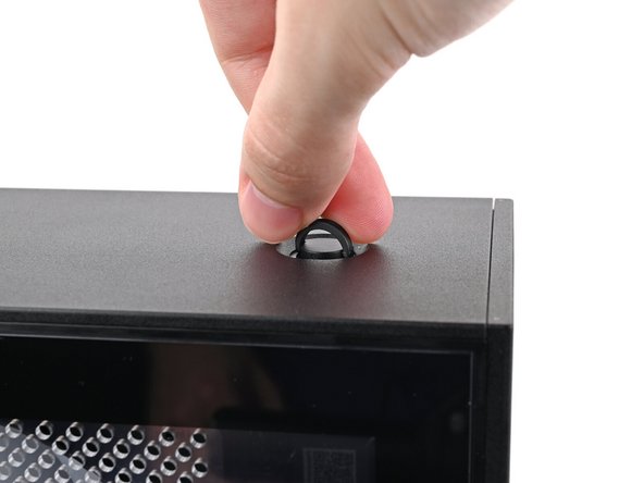 Insert the Top Panel screw into its hole and twist clockwise until it feels snug.