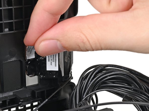 Use your fingers to peel the left antenna's copper film off the chassis.