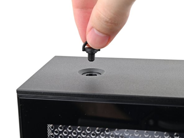 Repeat the same procedure for the other Top Panel screw.