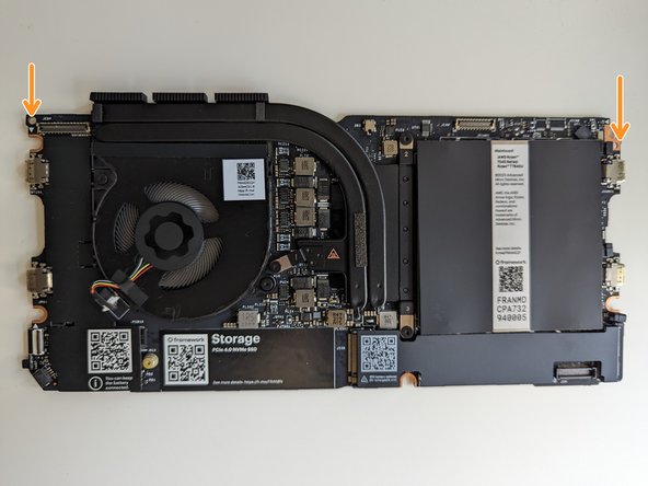 The easiest way to properly install the Mainboard is by aligning the two alignment pins on the Bottom Cover with the two holes on the Mainboard.