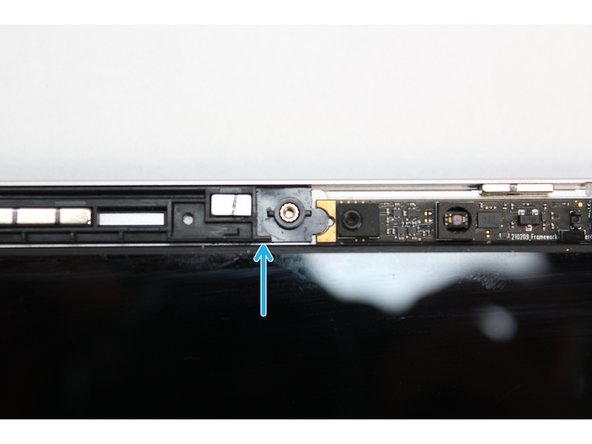 Using your fingers, place the washers over the Webcam making sure the notch on the washer aligns with the notch on the Top Cover as indicated in the third image.