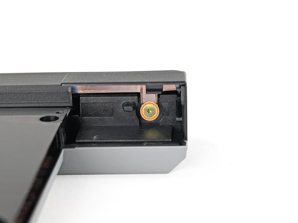 Two screws on the thin edge of the module, near the ends. You'll need to flip the module on its back edge to access them.