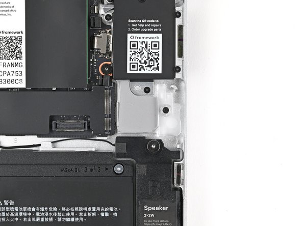 Use your Framework Screwdriver to loosen the captive T5 Torx screw securing Wi-Fi module cover.