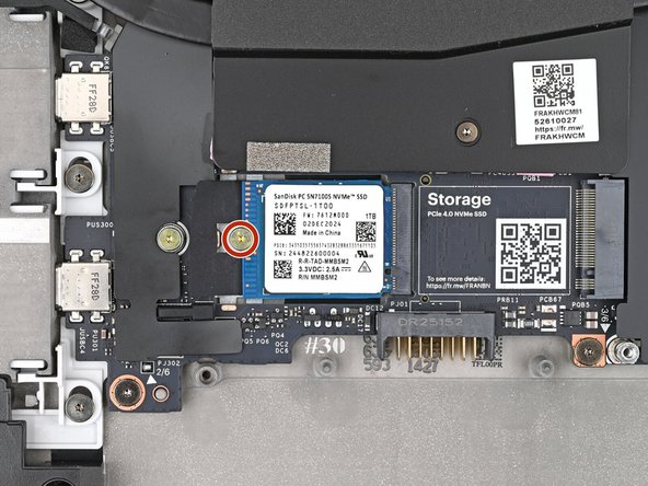 Use your Framework Screwdriver to install the 2 mm‑long T5 Torx screw securing the SSD.