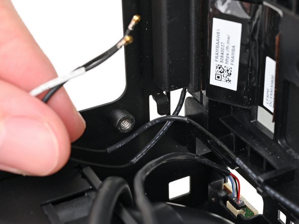 Push the antenna cables out of the metal hook in the chassis.