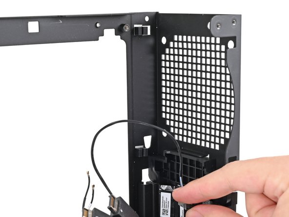 Pull the power button cable out of its rubber clips on the chassis.