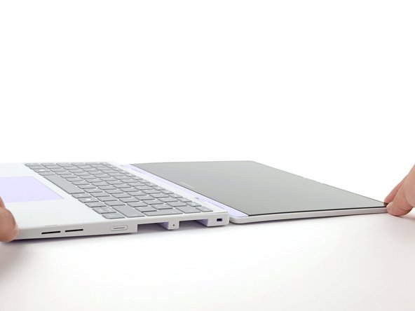 Open the laptop lid so that both the screen and the base lie flat on your work surface.