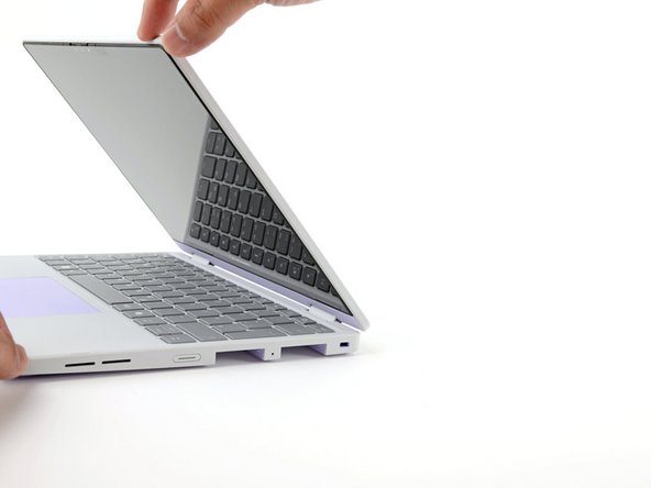 Open the laptop lid so that both the screen and the base lie flat on your work surface.