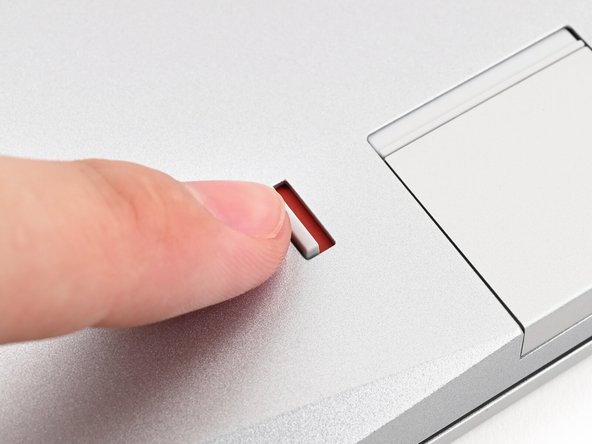 Use your finger to flip both latches and lock the row of Expansion Cards above them.