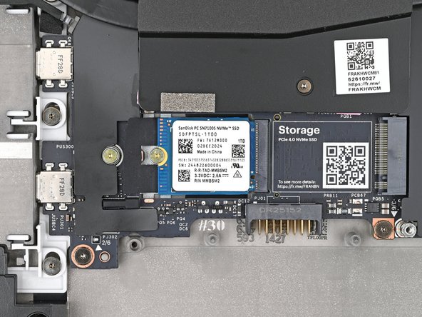 Use your Framework Screwdriver to install the 2 mm‑long T5 Torx screw securing the SSD.