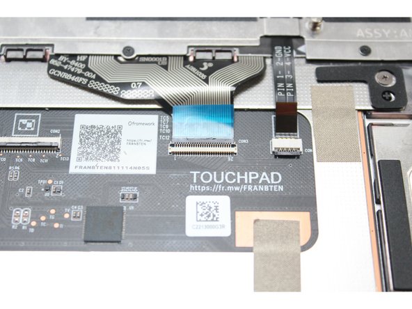 Flip the black latch down to secure the cable.