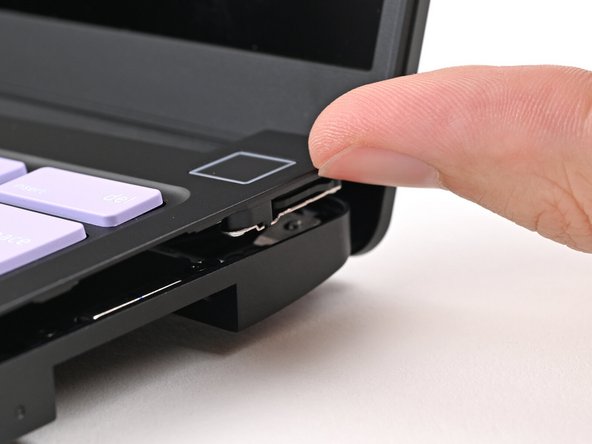 Use your fingers to lift the Input Cover up and release it from its magnets.