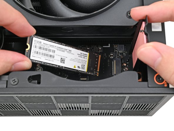 Hold the SSD by its edges. Don't touch the gold contacts with your fingers. If you do, wipe the contacts with a clean, lint-free cloth to remove any finger oils.