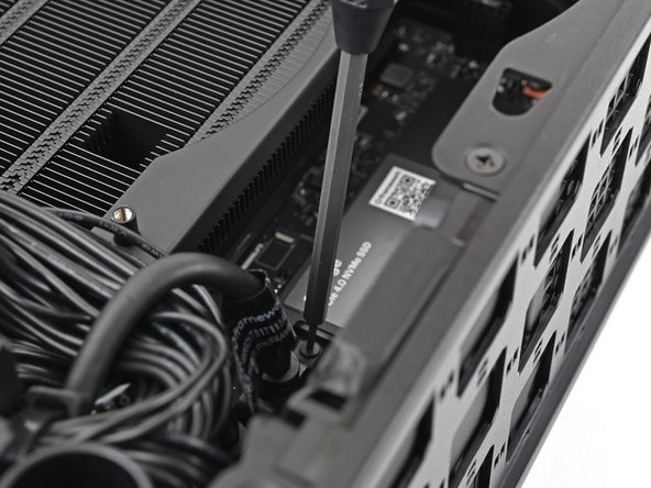 Tighten the screw securing the SSD.