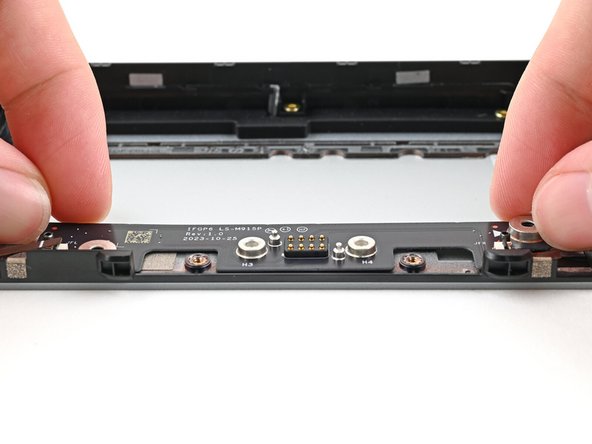 Place the board straight on its alignment pegs on Expansion Bay Shell.