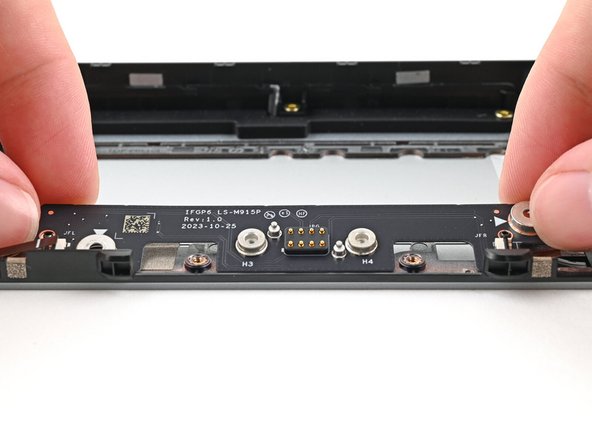 Place the board straight on its alignment pegs on Expansion Bay Shell.