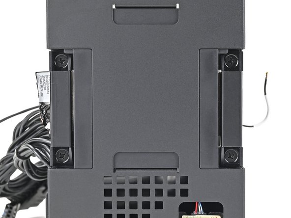 Use your Framework Desktop Screwdriver to install the two 4.0 mm‑long Phillips screws securing the left antenna.