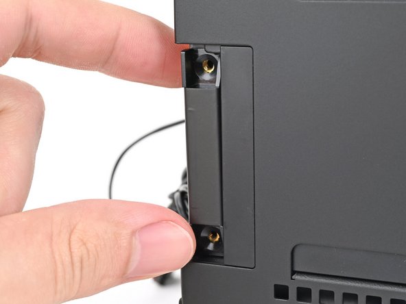 Place the replacement left antenna into its slot on the chassis.