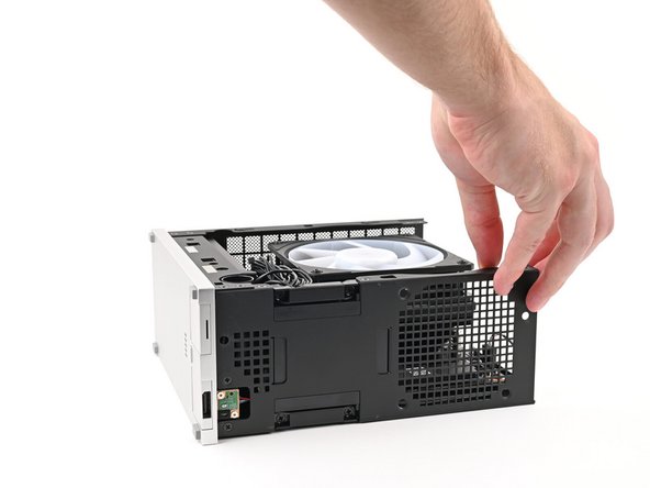 Lay the right side of the Desktop on your work surface so the Mainboard is facing upward.