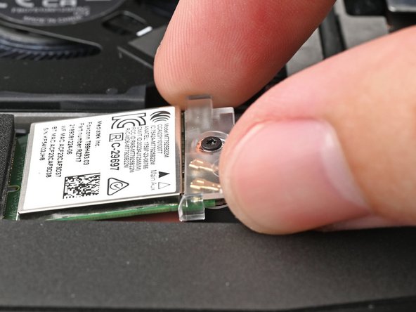 Slide the clear Wi-Fi module cover on the module and align its screw with the screw hole cutout.