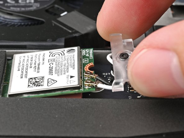 Slide the clear Wi-Fi module cover on the module and align its screw with the screw hole cutout.