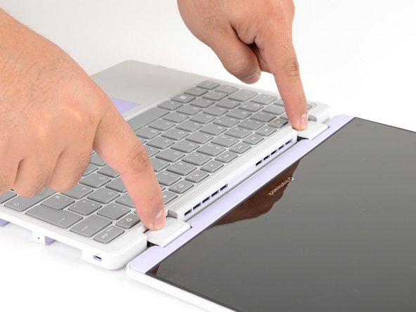 Use your fingers to grip the Input Cover in the hinge cutouts.