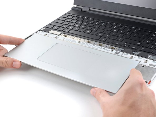 Lift the Touchpad Module and remove it.