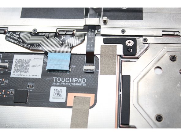 Flip the black latch down to secure the cable.