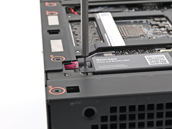 Tighten the screw securing the secondary storage.