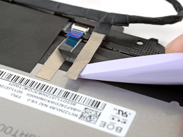 Lift slowly to separate the tape from the display.