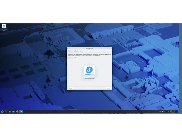 Once it boots to the Live media, you will notice a box. Buttons presented are Skip and Next; ignore those  two options entirely. The large button with the Fedora logo is the one we want to pay close attention to. Click that, the screen will flash and the installer process will appear.