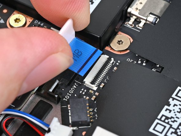 Slide the Audio Board cable straight into its socket.