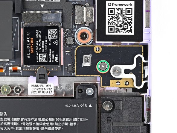 Use your Framework Screwdriver to loosen the captive T5 Torx screw securing the Fingerprint Reader.
